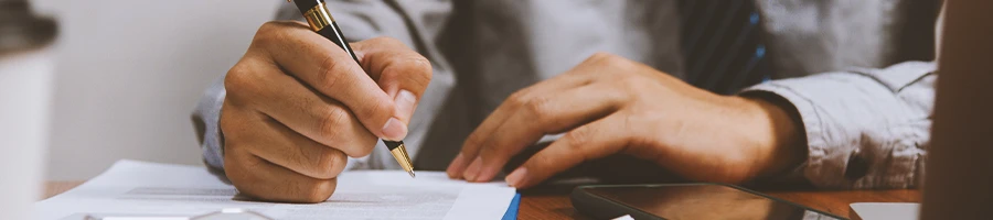 An office worker checking how much an LLC cost in New Hampshire