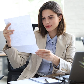 A business woman reading Iowa's certificate of existence