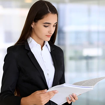 A woman reading an annual report