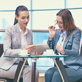 Two women discussing business