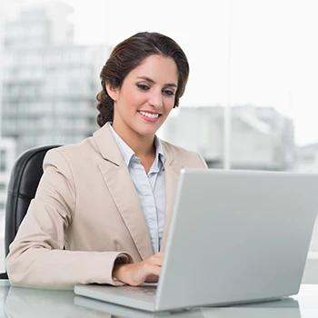 A smiling business woman working on business name registration