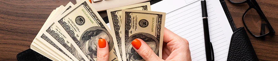 A top view of a woman counting money