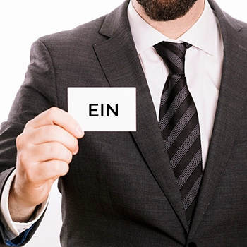 Businessman showing EIN card