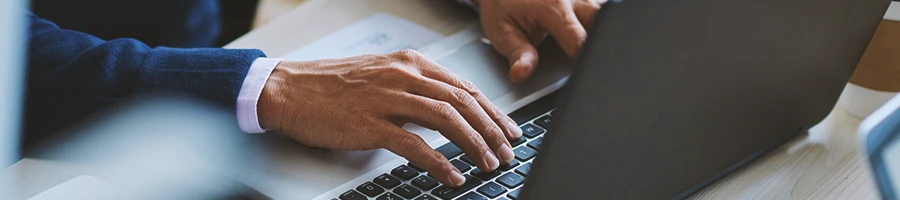 A person filing paperwork through emails