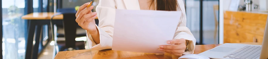 A person looking at paperwork in the office