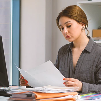 A person looking at paperworks to form an LLC in Maryland