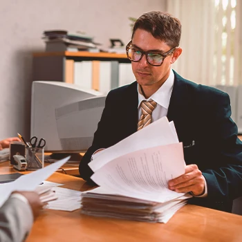 A person filing paperwork in person