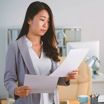 A person filing paperwork in person