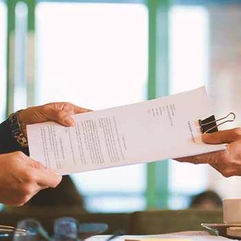 A person filing paperwork in person