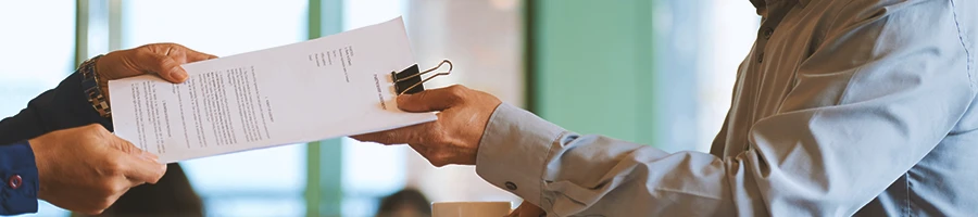 A person filing paperwork in person