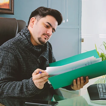 A person filing paperwork through the mail