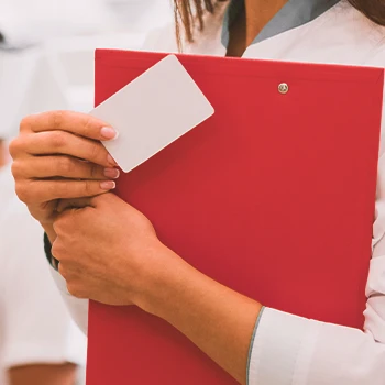 A person holding paperwork