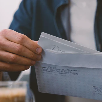 A person filing paperwork through mail