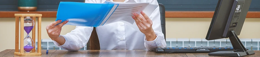 An office worker waiting for paperwork processing