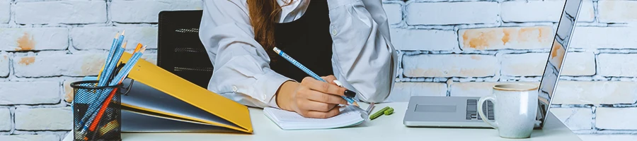 An LLC owner signing paperwork