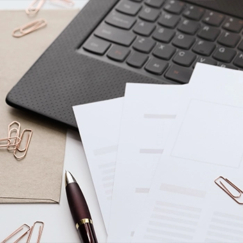 Filing documents on a laptop