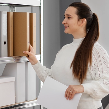 A woman organizing files in Pennsylvania office