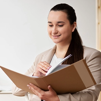 A woman holding a folder of documents about LLC processing time in Rhode Island