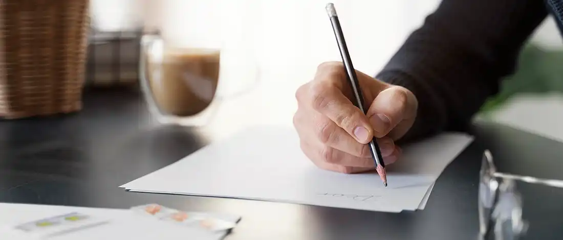 Venture Smarter | Can I Be My Own Registered Agent? (Explained) Business owner writing on paper and thinking can i be my own registered agent