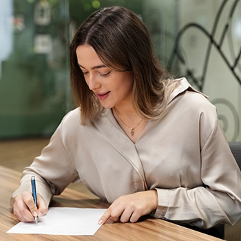 A business woman filing legal documents and starting skincare line business