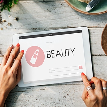 A tablet device with a beauty brand logo