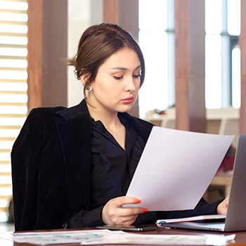 Woman filing an annual report in Alabama office