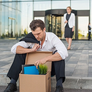 Alone outside with a box, fired by a business partner