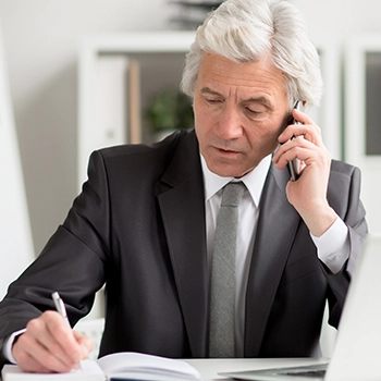 Businessman talking to phone about different types of llc