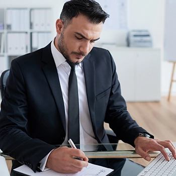 Businessman reading Kentucky LLC Tax