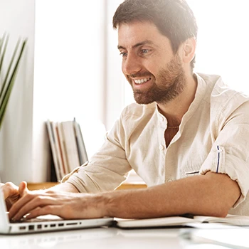 Man busy working on laptop and filing LLC taxes in Nebraska