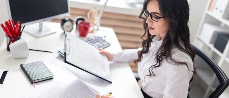 Woman reading document online about LLC taxes in Mississippi