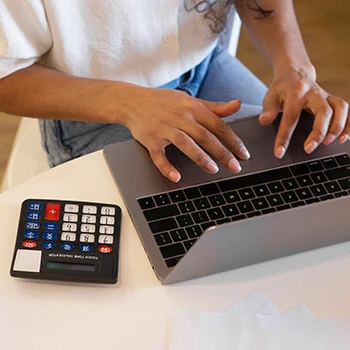 Woman using a laptop for Nebraska sales tax