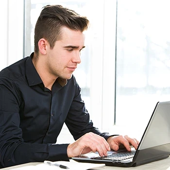 A guy working on his laptop