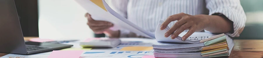 A person working on paper works in the office