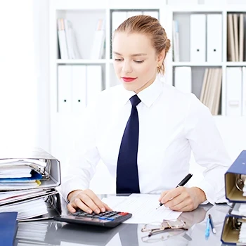 A woman computing the sales and use tax