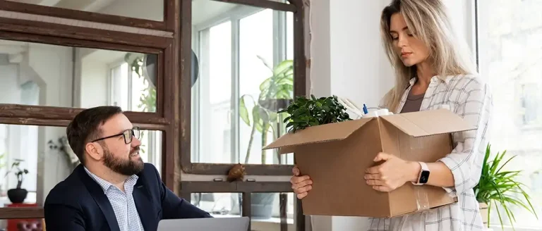 Man talking to business partner to fire her