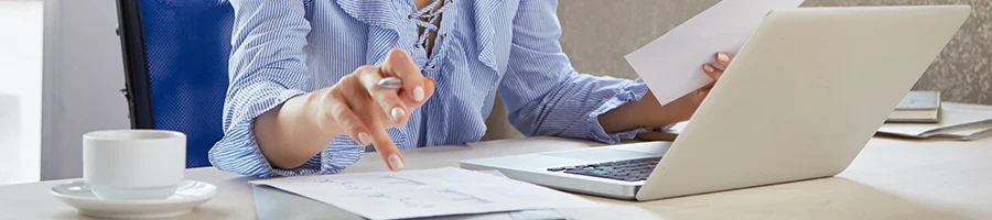 A woman working on taxes for North Dakota LLCs