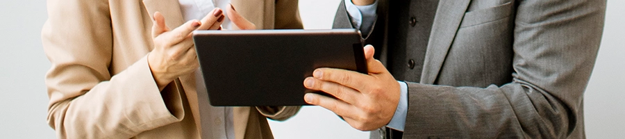 Businessmen having a small talk and holding a device