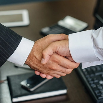 Businessman handshaking with a registered agent