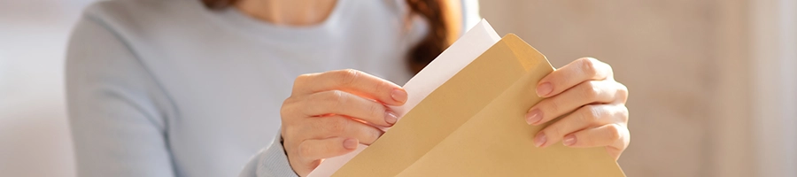 A woman holding a letter of resignation