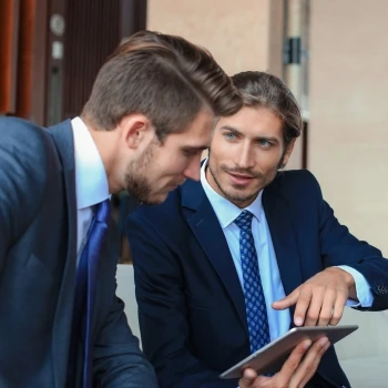 Two guys having a discussion in an office