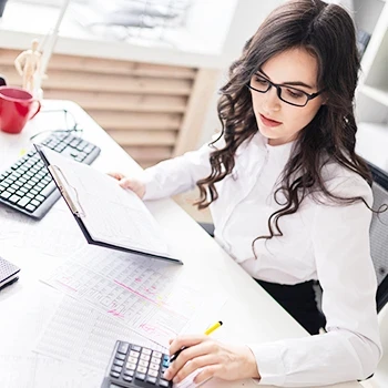 A woman computing the annual report filing fee