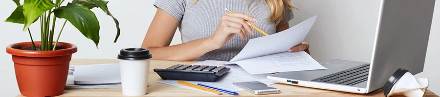 A woman in an office filing for a New Hampshire annual report