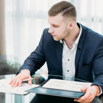 A man in his office working on important documents