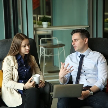 A man and a woman having a business discussion