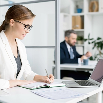 Woman writing sales tax