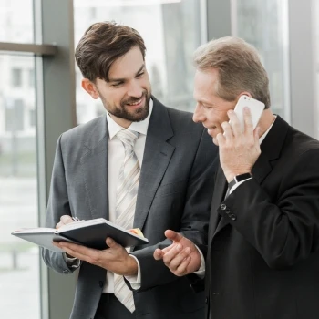 Two individuals having a business conversation