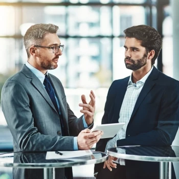 Two business men having a conversation about LLC operating agreement