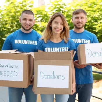 Volunteers holding donation boxes