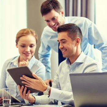 Three business people having a discussion in the office